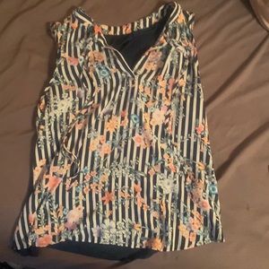 White and navy blue striped shirt with floral print.